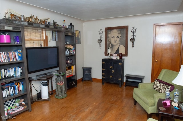 sitting room with hardwood / wood-style flooring