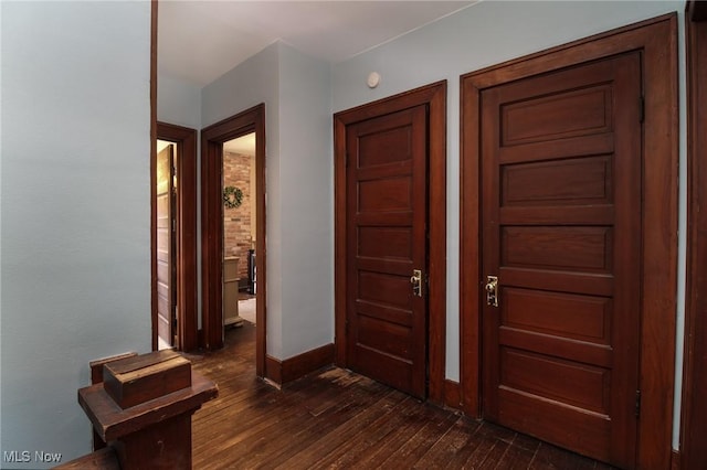 entryway with dark hardwood / wood-style floors