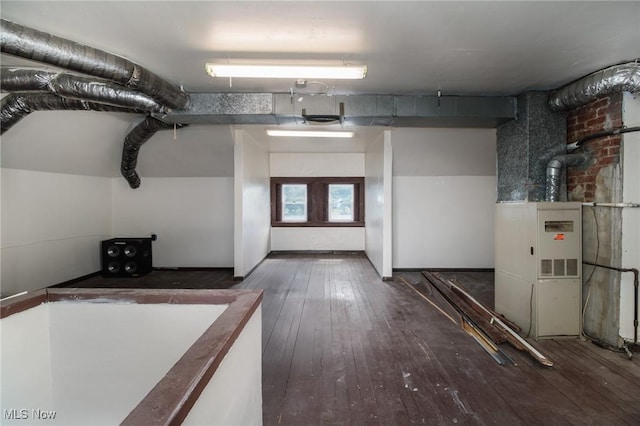 basement featuring dark hardwood / wood-style floors