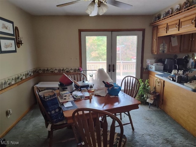 dining room featuring french doors, ceiling fan, and carpet flooring