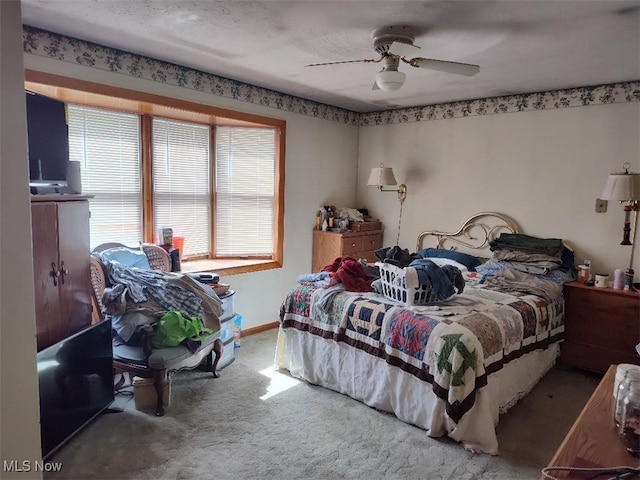 bedroom with ceiling fan and carpet