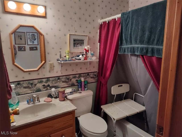 bathroom featuring vanity and toilet