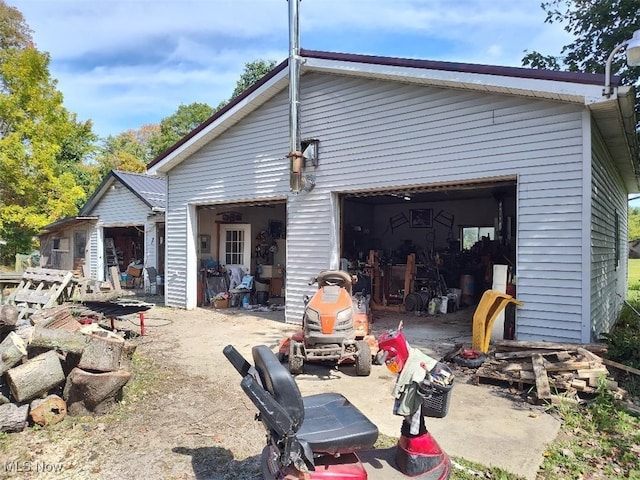 rear view of property with a garage