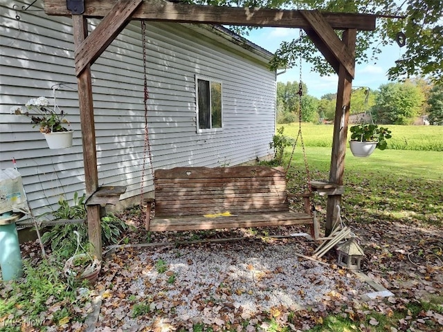 view of property exterior featuring a lawn