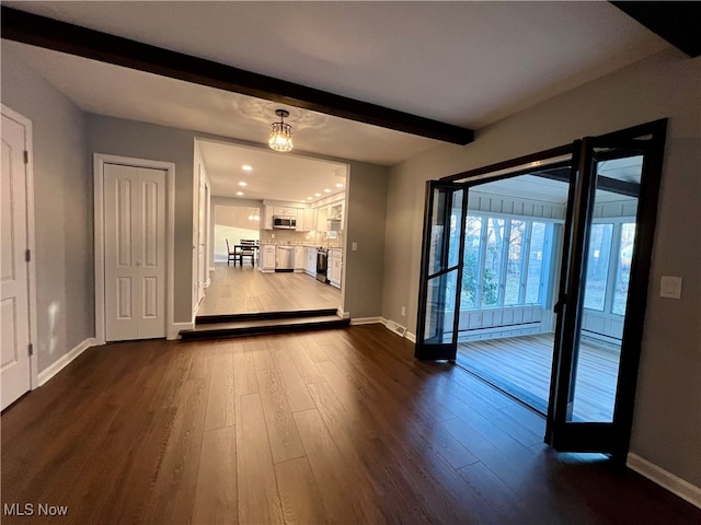 interior space with beam ceiling and dark wood-type flooring