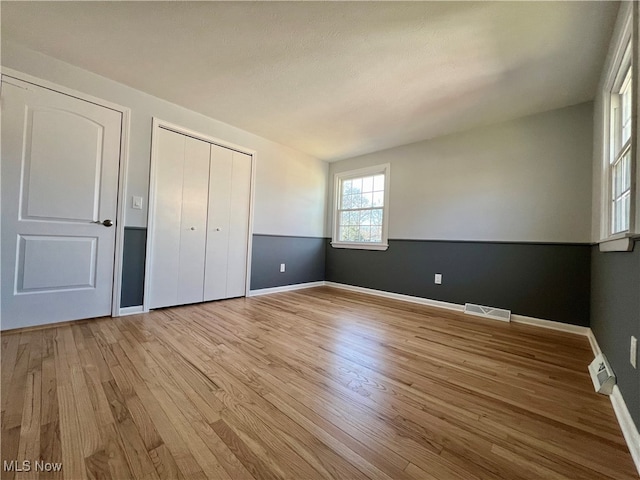 unfurnished bedroom with light hardwood / wood-style flooring