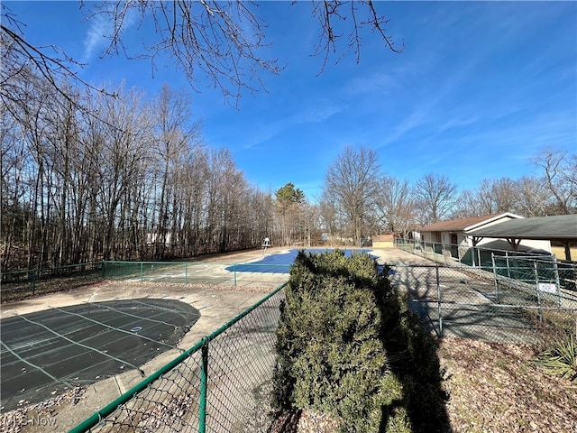 view of pool with tennis court