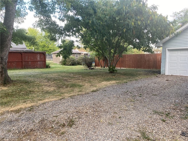 view of yard with a garage