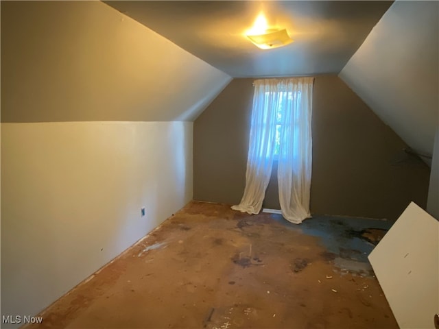 additional living space with lofted ceiling