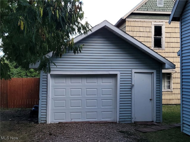 garage featuring wood walls