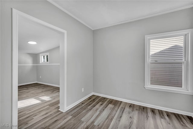 empty room with light hardwood / wood-style flooring