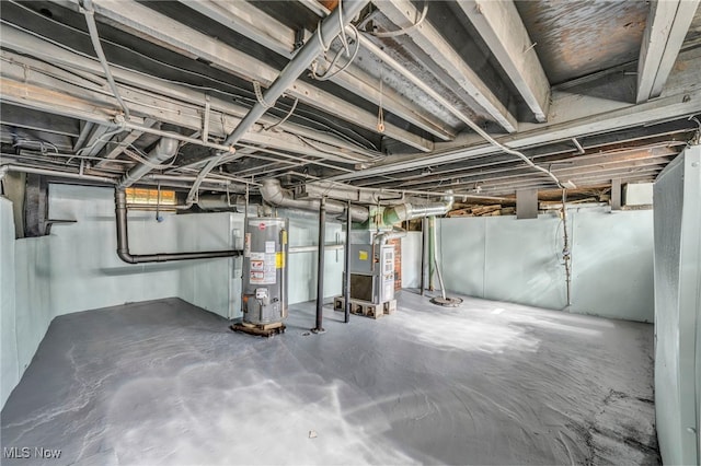 basement featuring water heater and heating unit