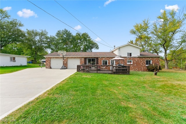 ranch-style house with a front yard, a garage, and a wooden deck