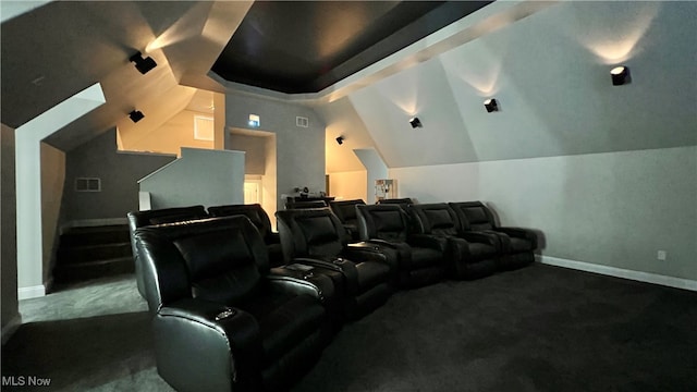 cinema with lofted ceiling and carpet floors