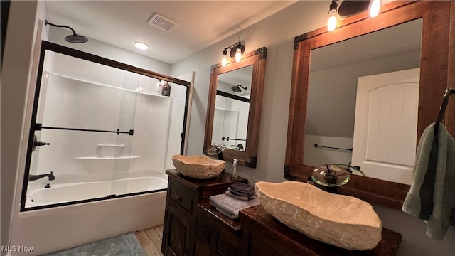 bathroom with vanity, combined bath / shower with glass door, and hardwood / wood-style flooring