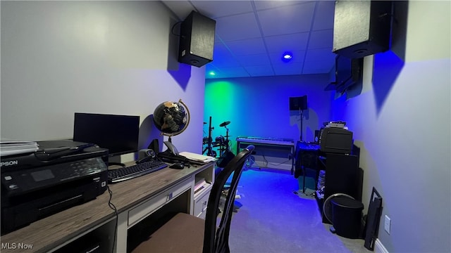 office featuring a drop ceiling and light colored carpet