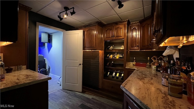 kitchen with decorative backsplash and dark hardwood / wood-style floors