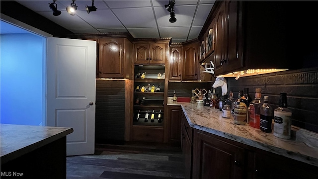 interior space featuring dark hardwood / wood-style floors and dark brown cabinetry