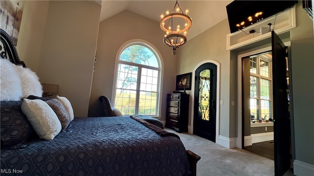 bedroom with carpet and vaulted ceiling