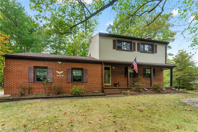 front facade with a front yard