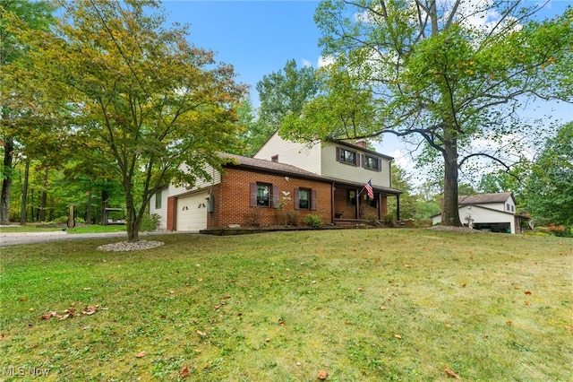 view of front of property with a garage and a front yard