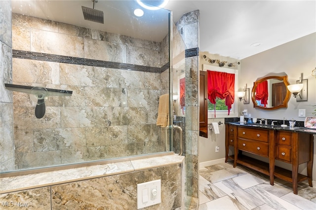 bathroom featuring vanity and a shower with shower door