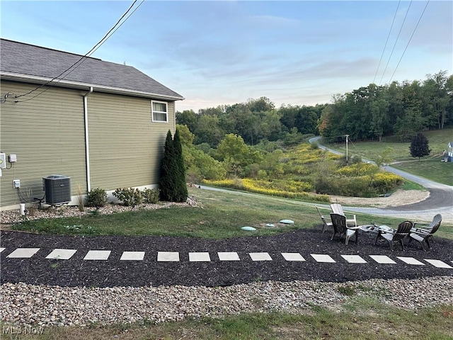 view of yard with central air condition unit