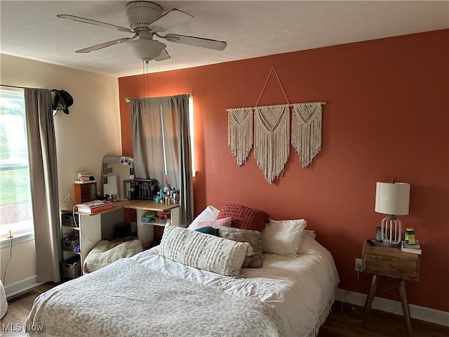 bedroom featuring ceiling fan and wood-type flooring