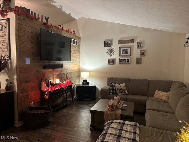 living room with wood walls and dark hardwood / wood-style floors