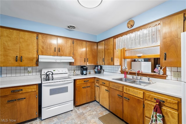 kitchen with white range with electric cooktop, sink, and decorative backsplash