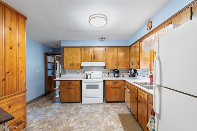 kitchen featuring white appliances, tasteful backsplash, and sink