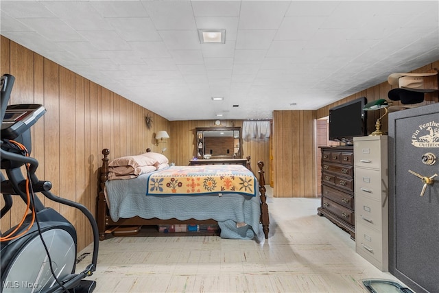 bedroom with wood walls