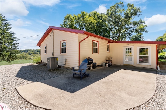 back of house with a patio and cooling unit