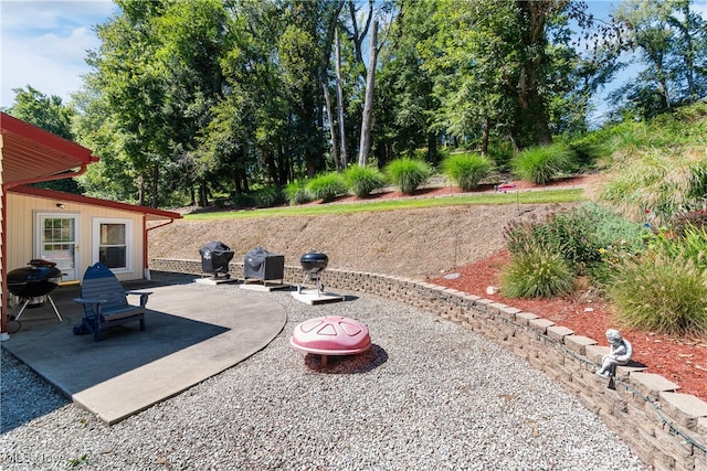 view of patio / terrace with a fire pit