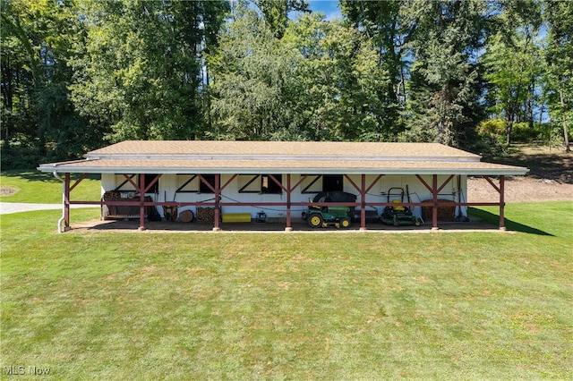 view of parking featuring a lawn and a carport