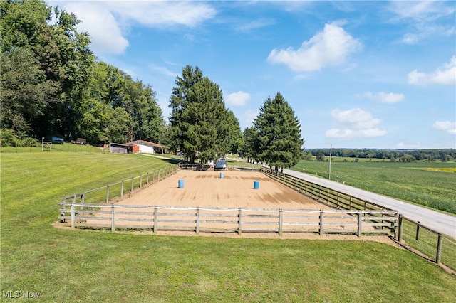 view of home's community with a yard and a rural view