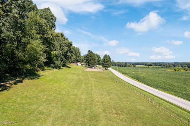 surrounding community with a lawn and a rural view