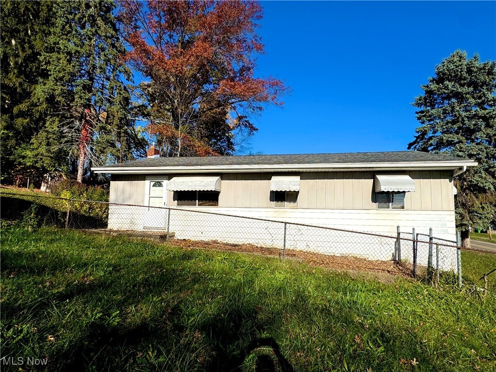 view of home's exterior with a lawn