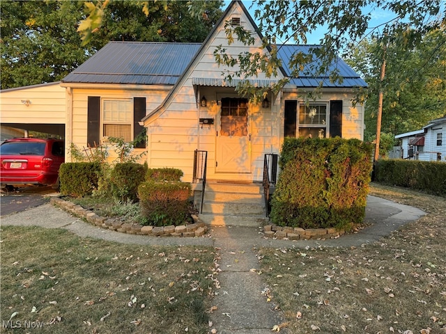 view of front of home featuring a carport