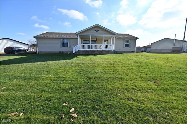 view of front of property with covered porch and a front yard