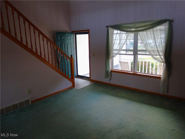 entrance foyer with light colored carpet