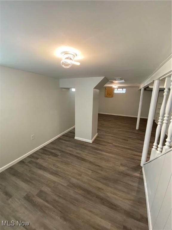 basement featuring dark wood-type flooring