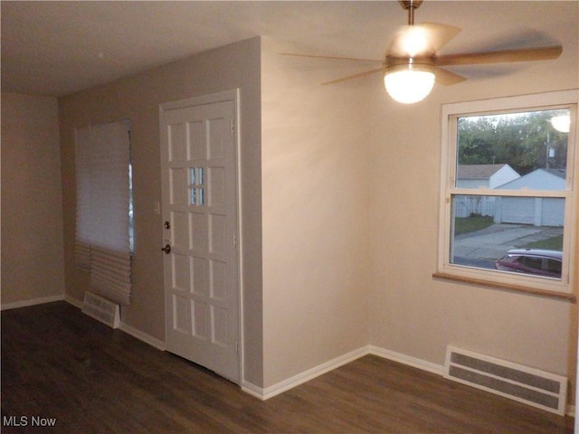 foyer with ceiling fan and dark hardwood / wood-style floors