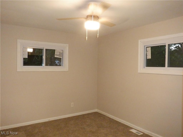 carpeted empty room with ceiling fan