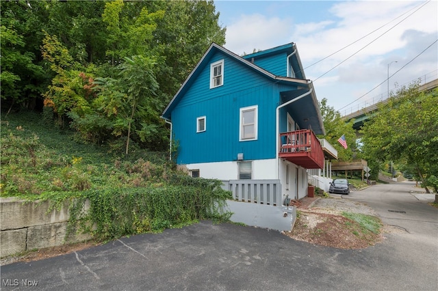 view of side of property with a deck