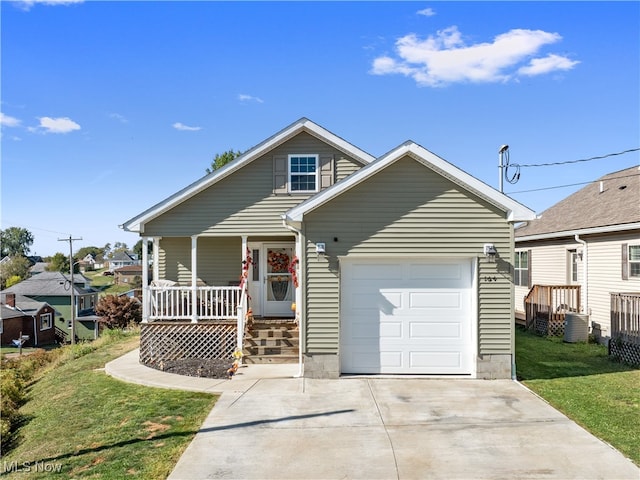 view of front of property with a front lawn, a porch, central air condition unit, and a garage