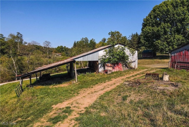 1701 New England Ridge Rd, Washington, WV 26181 - view of yard featuring a carport, an outbuilding, and a pole building