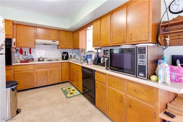 1701 New England Ridge Rd, Washington, WV 26181 - kitchen with under cabinet range hood, tasteful backsplash, light countertops, and black appliances