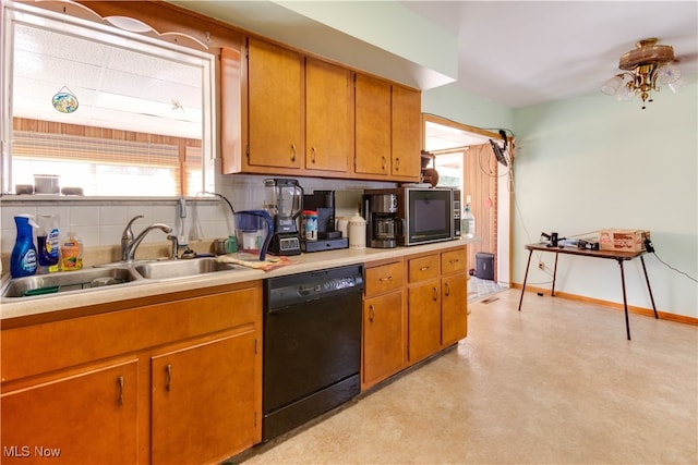 kitchen featuring black appliances, sink, and tasteful backsplash