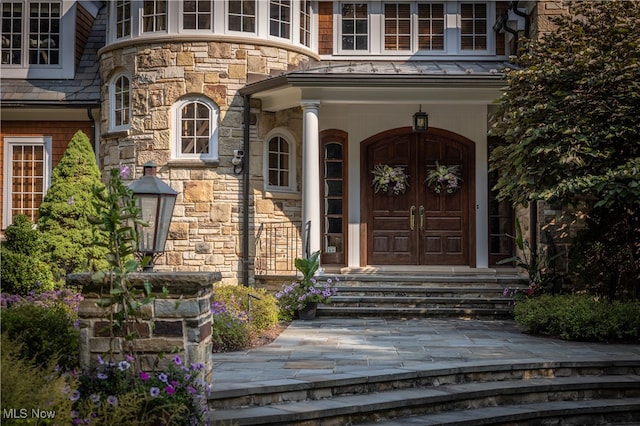 entrance to property with a porch